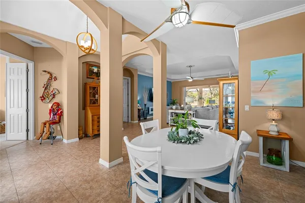 a view of a dining room with furniture wooden floor and a chandelier