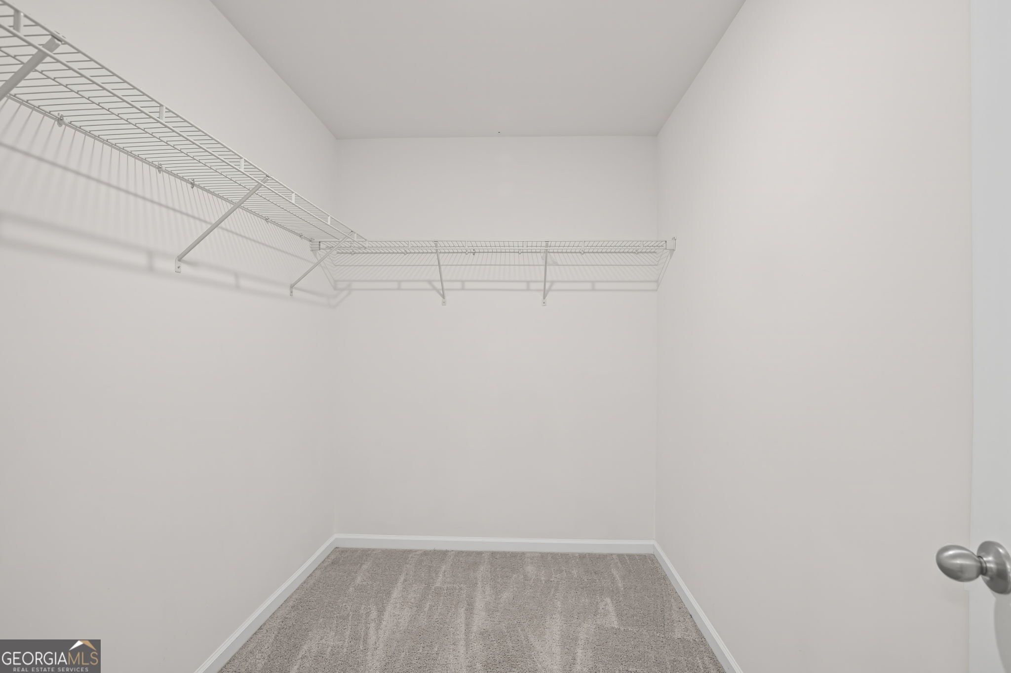 406 Kings Cross Way Cartersville, GA 30120 - Photo 21 of 28 a view of a room with racks on the wall