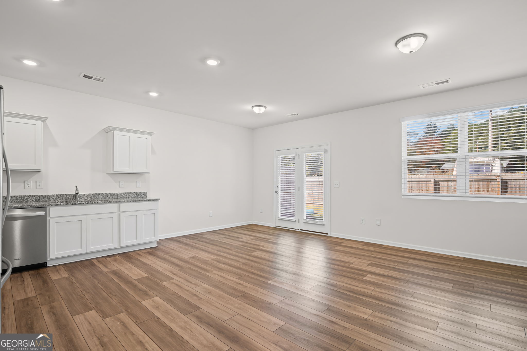 406 Kings Cross Way Cartersville, GA 30120 - Photo 4 of 28 a view of a kitchen with a sink and a stove top oven