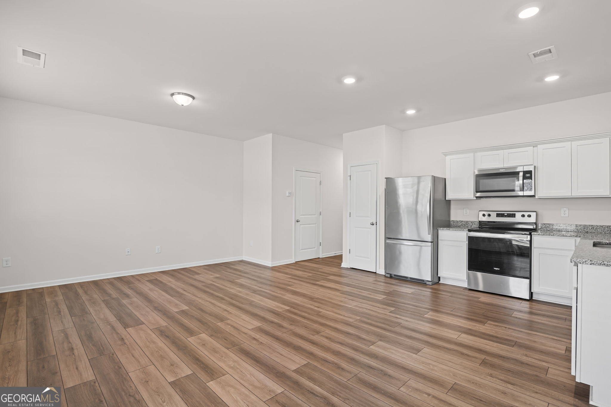 406 Kings Cross Way Cartersville, GA 30120 - Photo 5 of 28 a kitchen with stainless steel appliances a refrigerator and a stove top oven