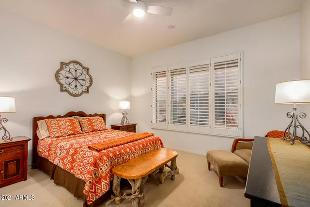 a bedroom with bed and a couch