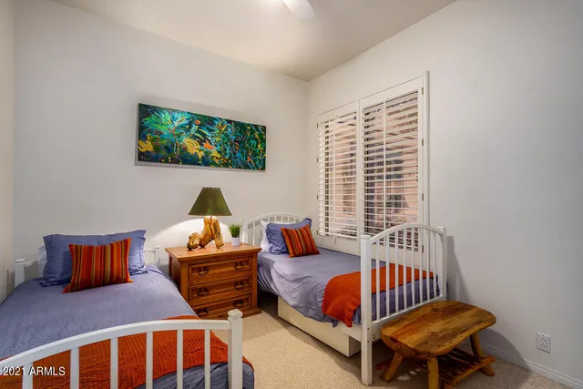 a bedroom with furniture and a window