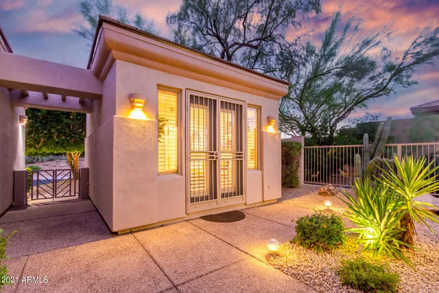 a view of a chair and table in the patio