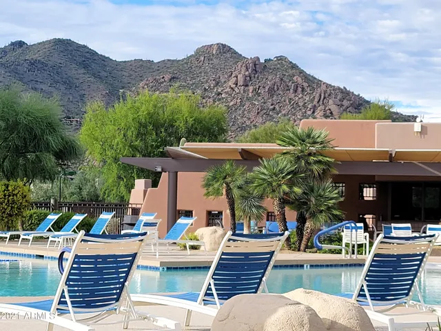 an outdoor space with patio area and furniture