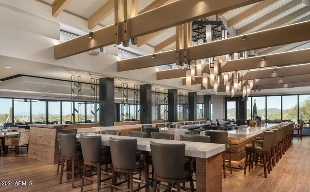 a dining hall with lots of table and chairs