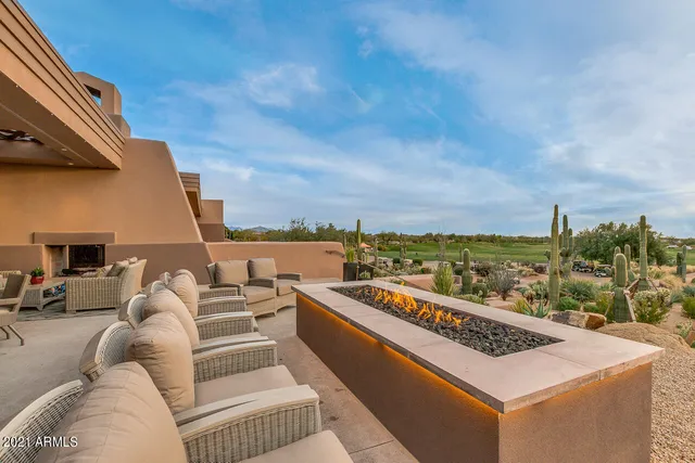 a view of roof deck with furniture