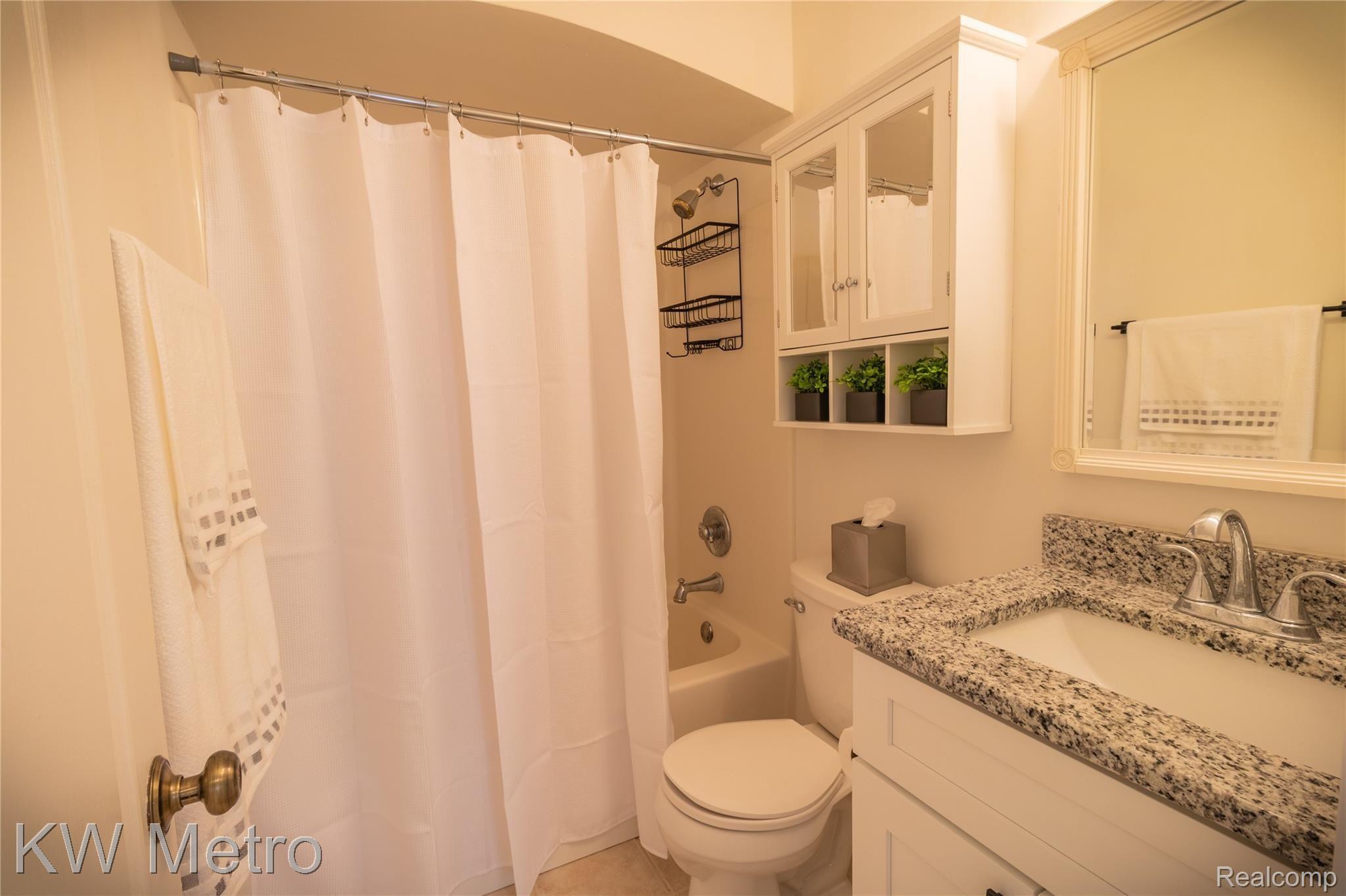 235 Eleanor Road Highland, MI 48356 - Photo 16 of 28 1st Floor Bathroom w/Updated Vanity and Ceramic Floor