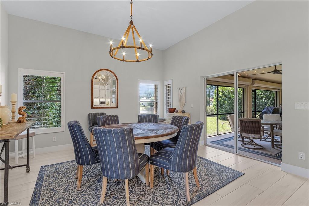 7596 San Miguel Way Naples, FL 34109 - Photo 12 of 34 a view of a dining room with furniture window and outside view
