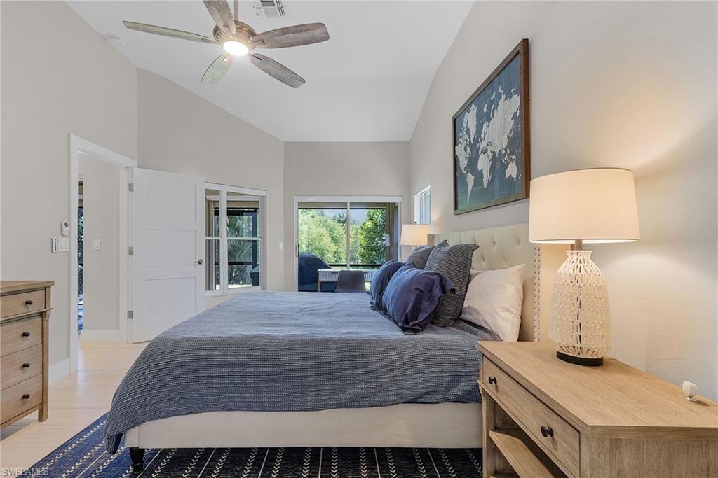 7596 San Miguel Way Naples, FL 34109 - Photo 14 of 34 a bedroom with a bed and window