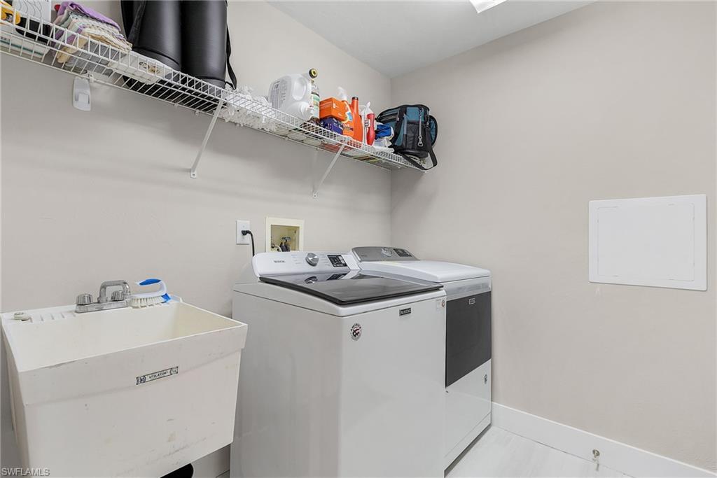 7596 San Miguel Way Naples, FL 34109 - Photo 21 of 34 a utility room with dryer and washer