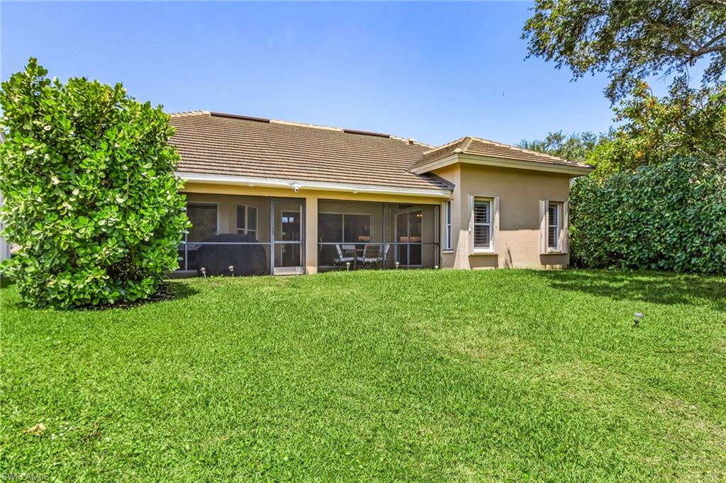 7596 San Miguel Way Naples, FL 34109 - Photo 24 of 34 a view of a house with yard and plants