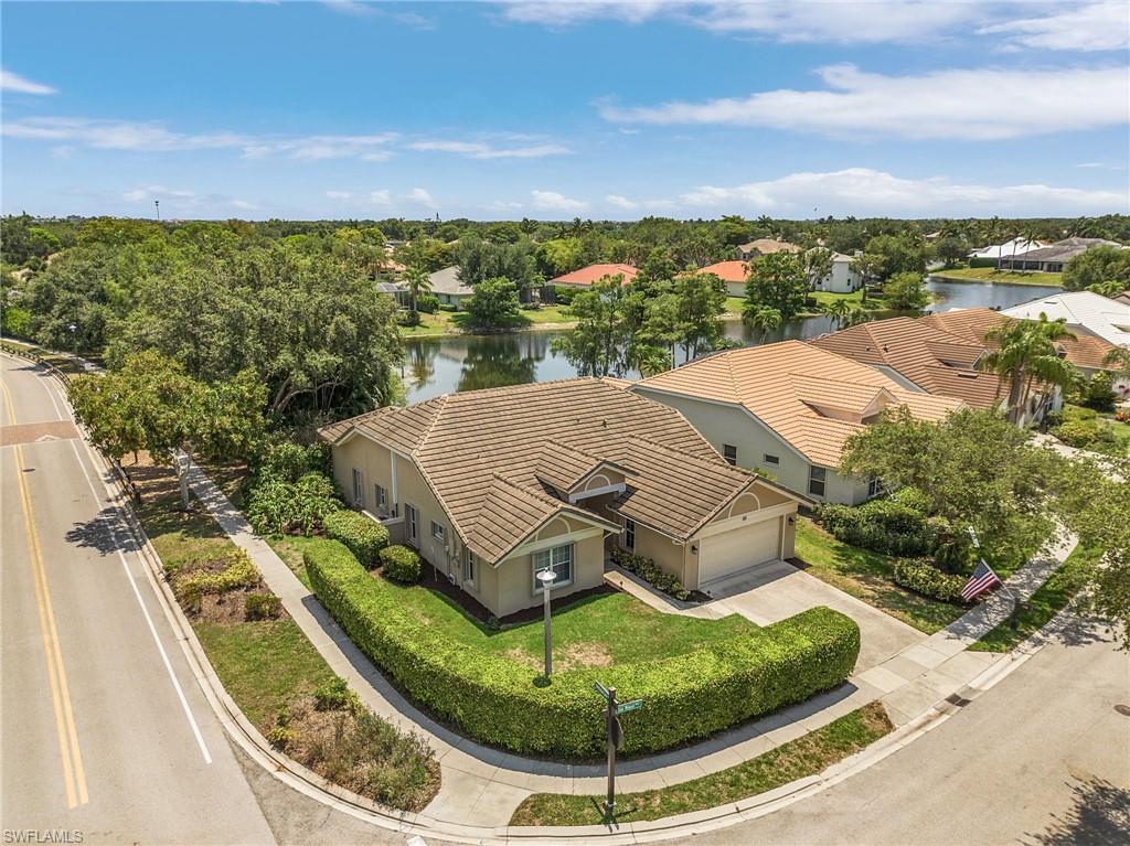 7596 San Miguel Way Naples, FL 34109 - Photo 25 of 34 a view of a swimming pool with a balcony