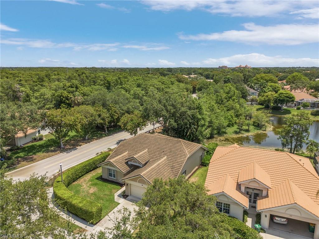 7596 San Miguel Way Naples, FL 34109 - Photo 26 of 34 an aerial view of a house with a yard