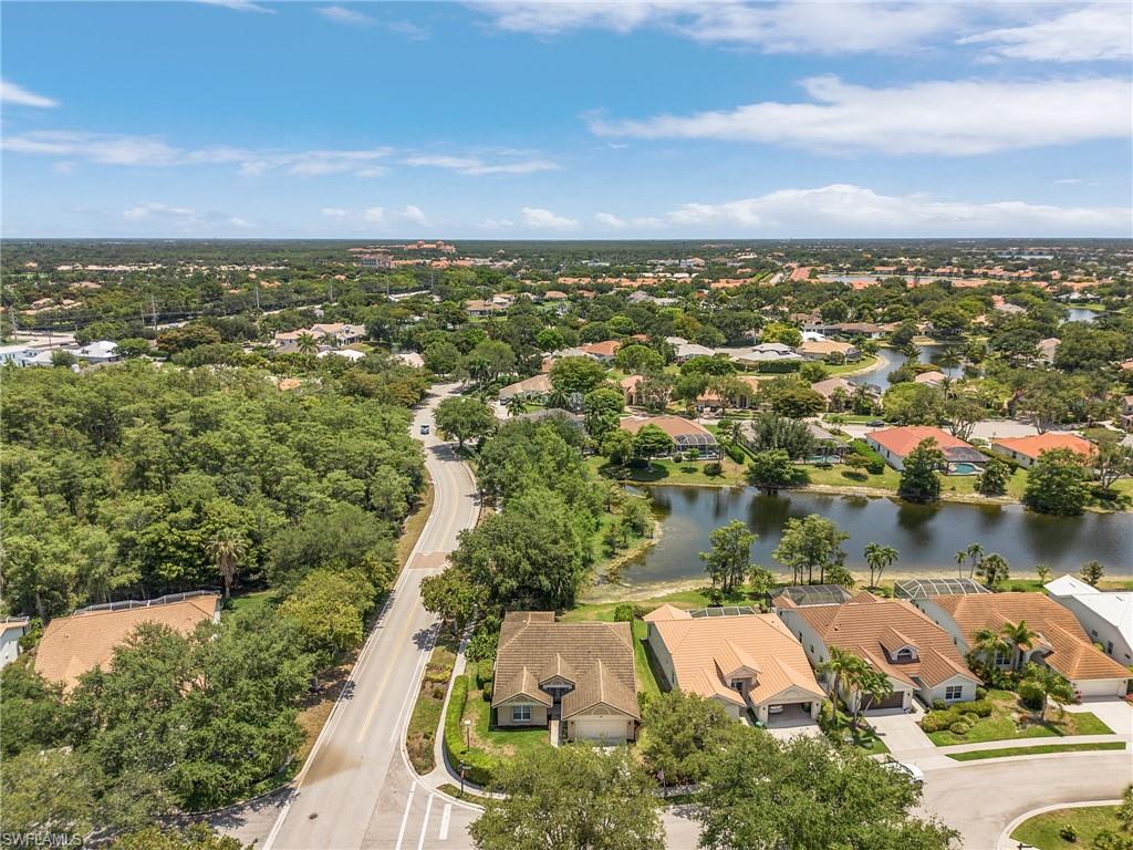 7596 San Miguel Way Naples, FL 34109 - Photo 27 of 34 an aerial view of residential houses with outdoor space