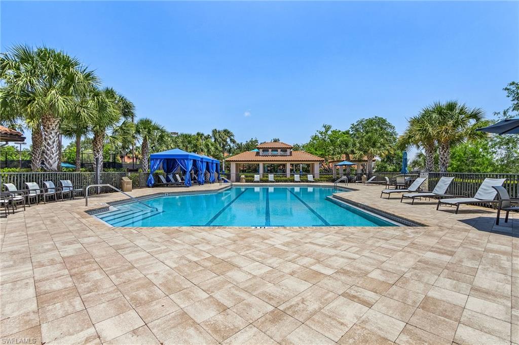7596 San Miguel Way Naples, FL 34109 - Photo 28 of 34 a view of swimming pool with chairs