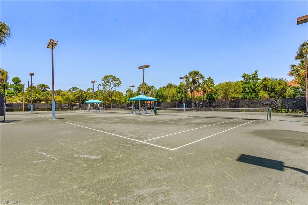 7596 San Miguel Way Naples, FL 34109 - Photo 29 of 34 a view of a tennis court