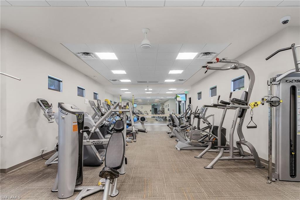 7596 San Miguel Way Naples, FL 34109 - Photo 31 of 34 a view of a room with gym equipment