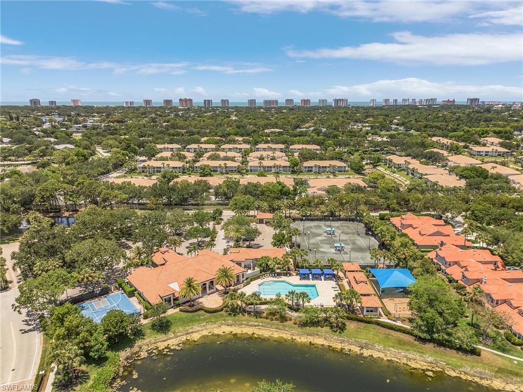 7596 San Miguel Way Naples, FL 34109 - Photo 32 of 34 an aerial view of residential houses with outdoor space