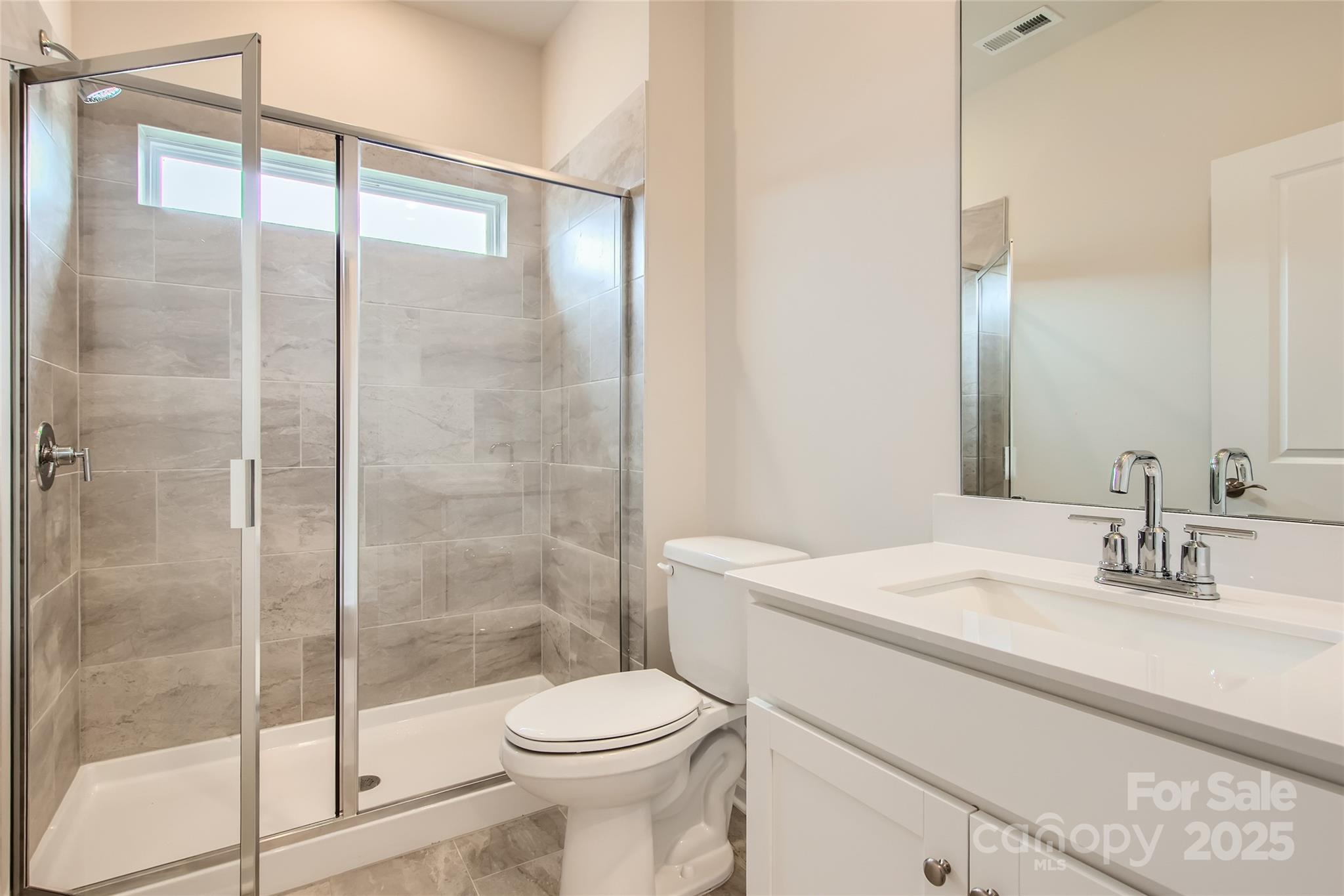8454 Norman Frst Road Lancaster, SC 29720 - Photo 10 of 16 a bathroom with a sink a toilet and shower