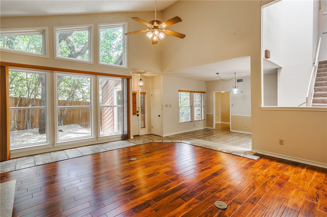 8121 Forest Mesa Drive Austin, TX 78759 - Photo 1 of 1 a view of an empty room with a window and wooden floor