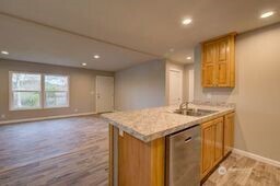 1331 Dolan Street Raymond, WA 98577 - Photo 12 of 32 a kitchen with a sink stove and cabinets
