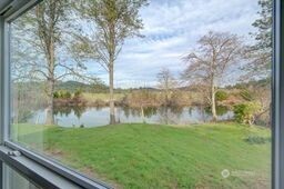 1331 Dolan Street Raymond, WA 98577 - Photo 24 of 32 a view of a lake from a yard