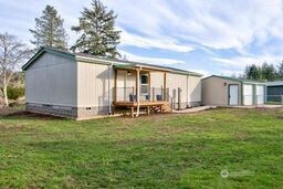 1331 Dolan Street Raymond, WA 98577 - Photo 4 of 32 a backyard of a house with table and chairs