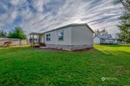 1331 Dolan Street Raymond, WA 98577 - Photo 5 of 32 a backyard of a house with lots of green space and fountain