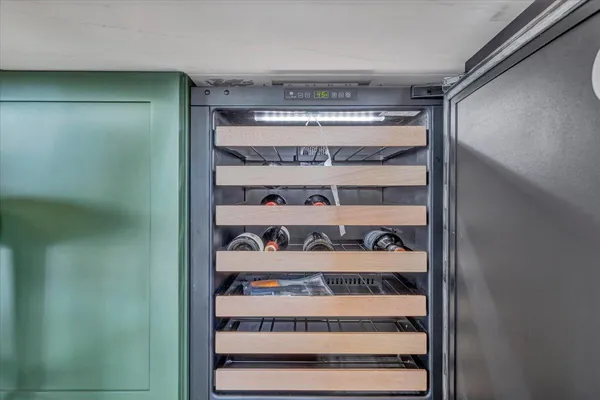 a view of walk in closet with clothes