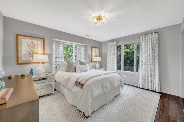 an aerial view of a house with a yard and lake view