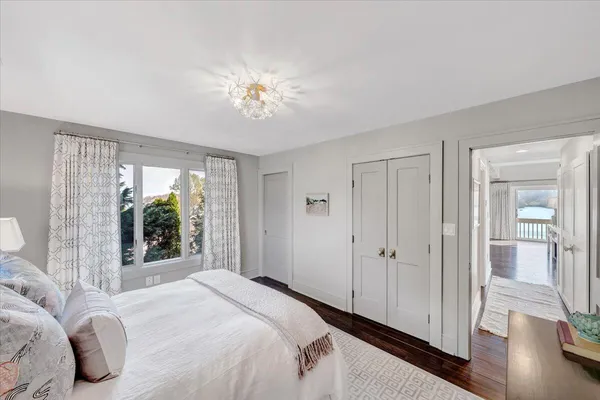 a view of a lake with a floor to ceiling window