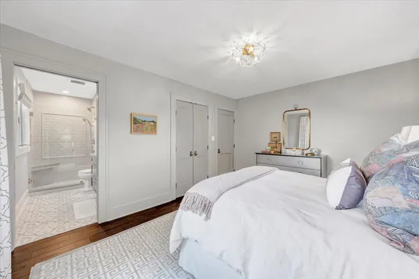 a front view of a building with a garden