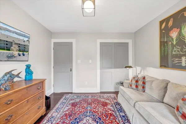 a bedroom with a bed and a dresser