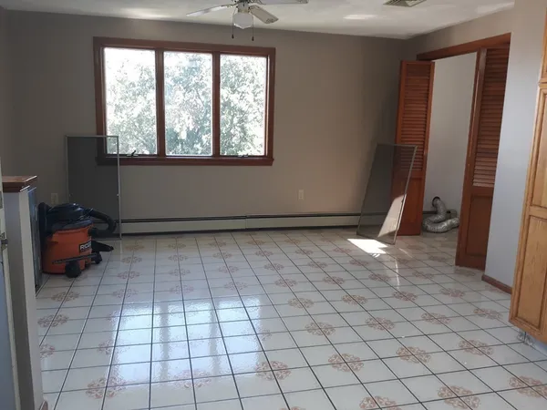 a view of an empty room and window