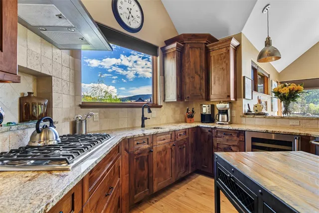 a kitchen with a stove and a sink