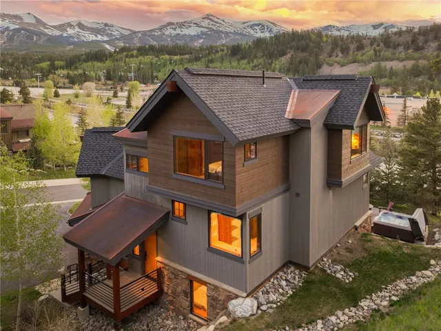 a aerial view of a house with pool and a fountain