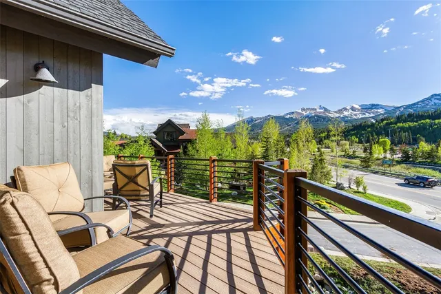 a view of a balcony with chairs