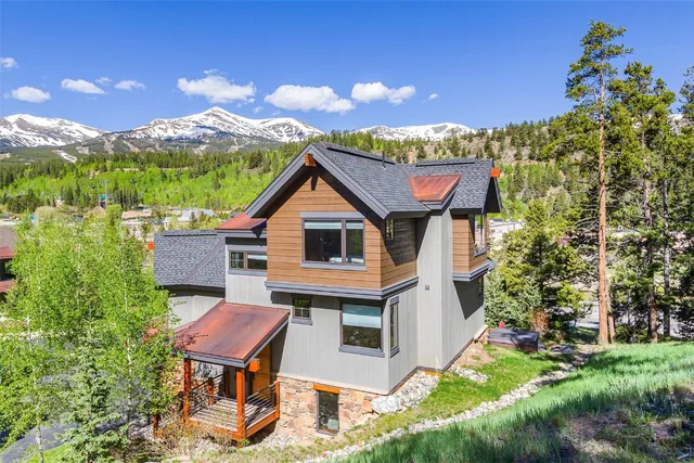 a aerial view of a house with a yard