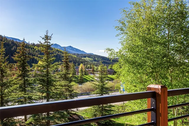 a view of a yard from a balcony
