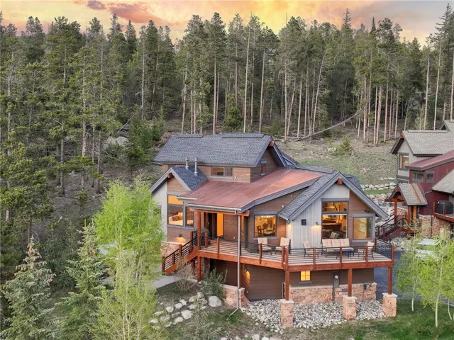 aerial view of a house with a yard