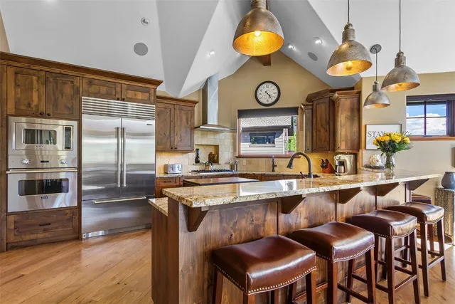 a kitchen with a sink cabinets and stainless steel appliances