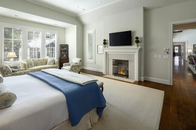 a spacious bathroom with a double vanity sink a mirror and a shower