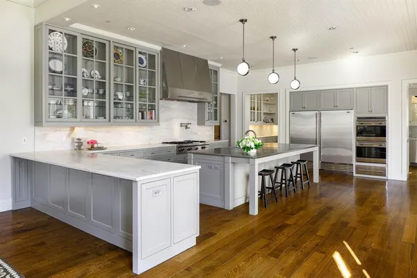 a dining room with furniture and floor to ceiling window