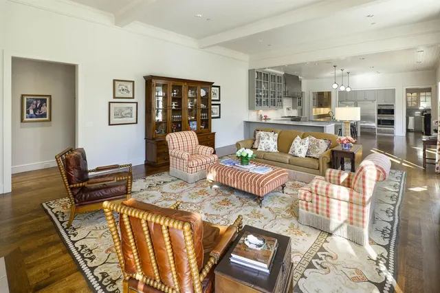 a bedroom with wooden floors and a bed