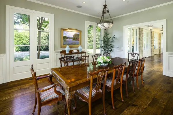 a living room with fireplace furniture and a large window