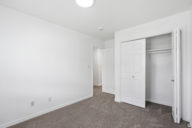 793 North 150 E Street Springville, UT 84663 - Photo 16 of 26 Neutral gray carpet flooring complements white painted walls and trim