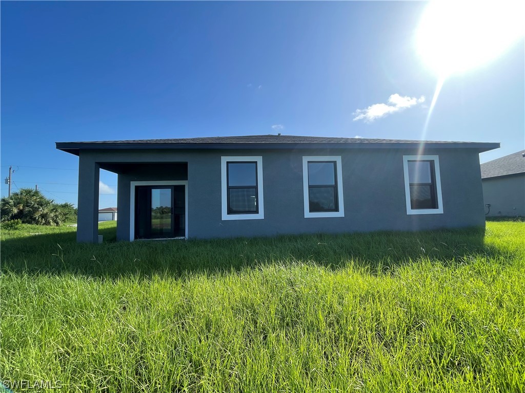 7045 Beaver Circle LaBelle, FL 33935 - Photo 2 of 2 a view of a house with a yard