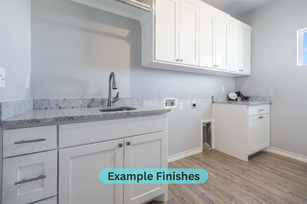 0 City Lake Road Canyon, TX 79015 - Photo 25 of 31 a kitchen with a sink cabinets and wooden floor