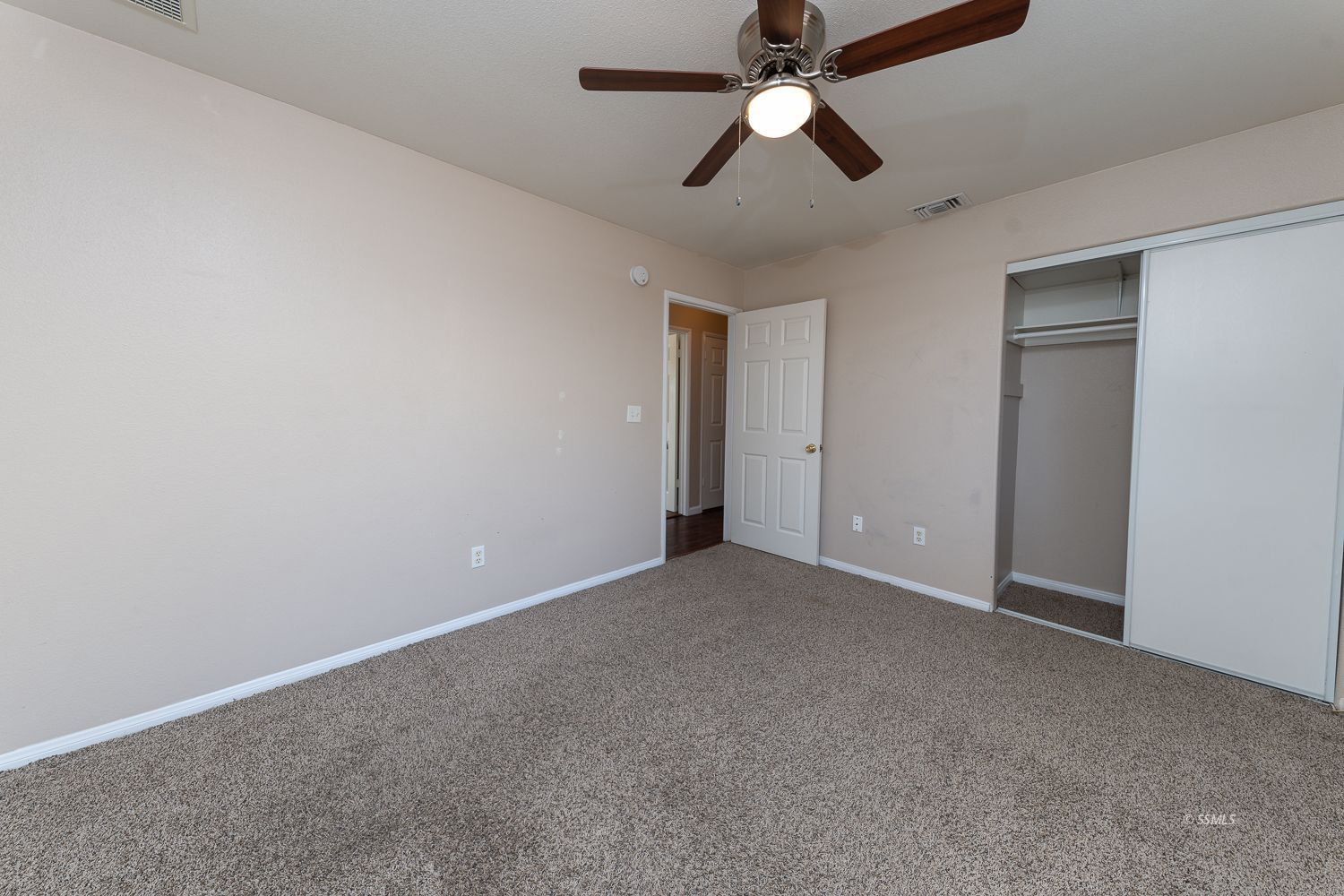 1237 West Boston Avenue Ridgecrest, CA 93555 - Photo 15 of 32 an empty room with a fan & a ceiling fan