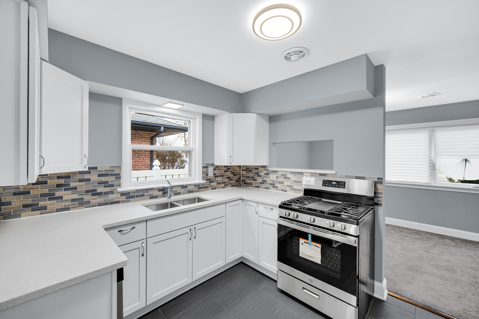 1522 186th Street Homewood, IL 60430 - Photo 12 of 22 a kitchen with stainless steel appliances a sink stove and cabinets